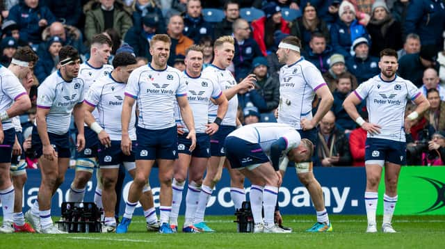 The Scotland team look on with dejection after defeat by France at BT Murrayfield.