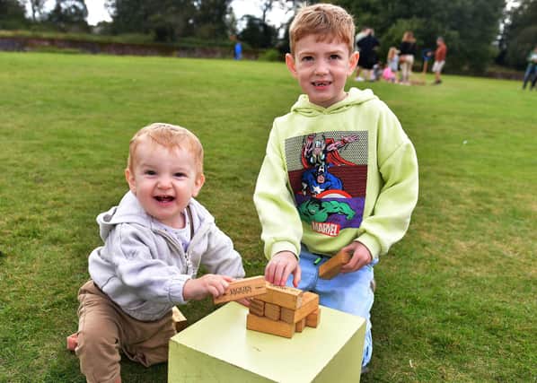 Teddy and Charlie Genery playing with the Jenga. Photos: Mick Fox