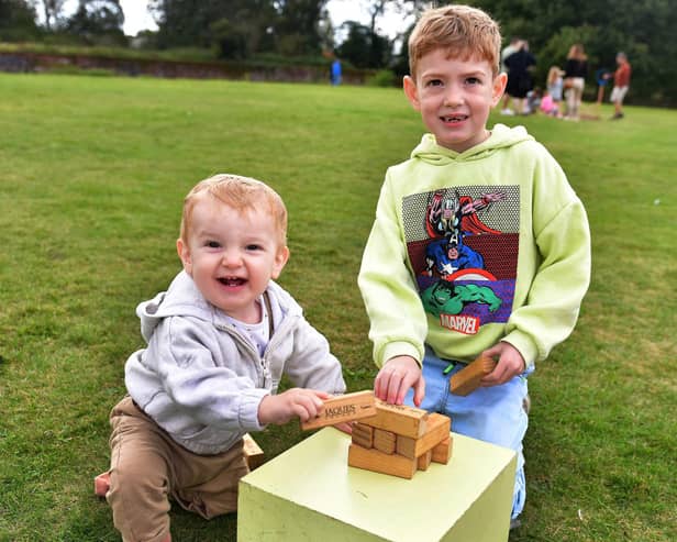 Teddy and Charlie Genery  playing with the Jenga. Photos: Mick Fox