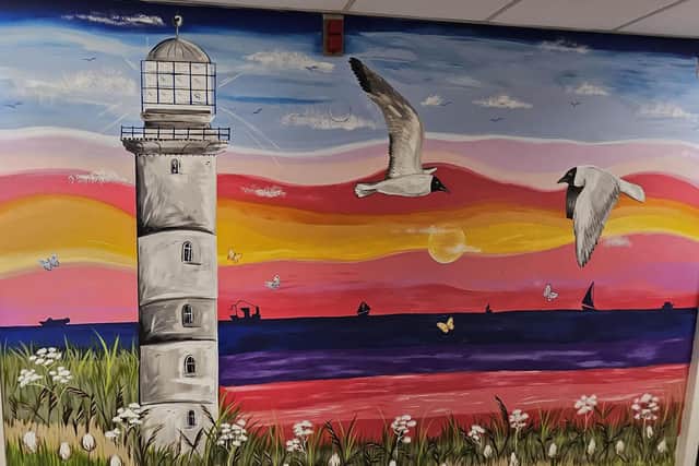 Beach scene painting at Gloucester Ward.