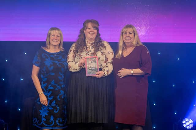 Julie Bishop, Ashleigh Robinson and Tracy Perrett accepting their award