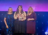 Julie Bishop, Ashleigh Robinson and Tracy Perrett accepting their award