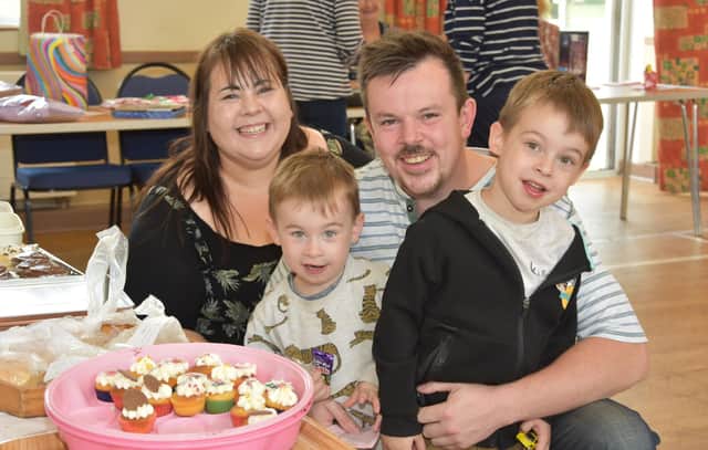 Donna, David and boys waiting for the Cup Cakes. Photo: John Edwards