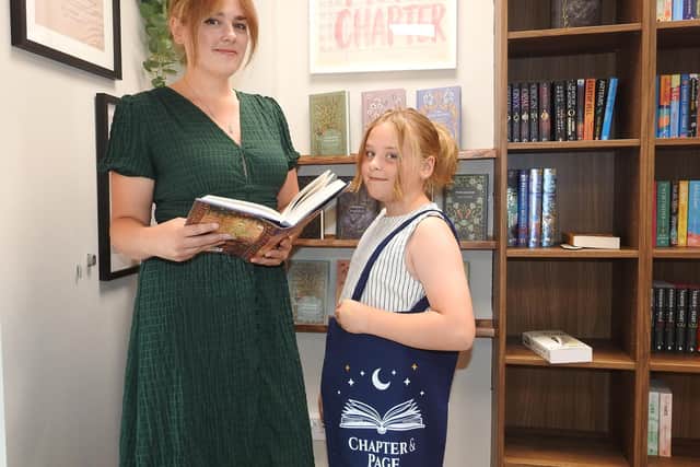 Embarking on a new literary adventure. Shannon Hanson and daughter Erin, nine, of Chapter and Page book shop.