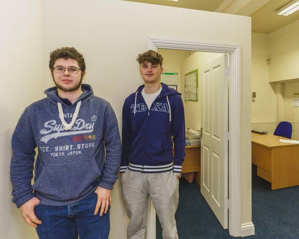 Apprentices Kenny and Drew in front of the new office