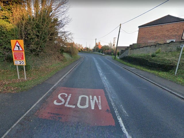 Warning signs on the approach to the bend.