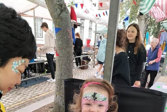 Facepainting at the Teenage Market.