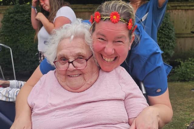 A staff member and one of the residents get into the spirit of things.