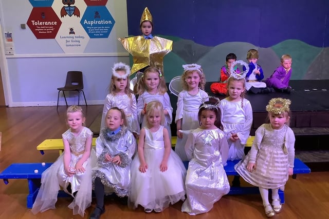 Angels and a star in William Alvey School's Nativity play.