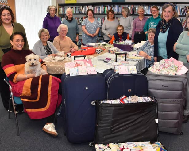 Team leader Christina Marriott (left, with dog on knee) and the rest of the Africa Project volunteers in Wragby.
