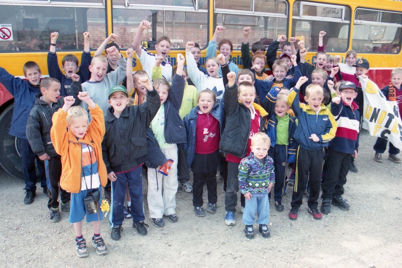 Boston United supporters standing in front of the open-top bus at the club's former home in York Street.