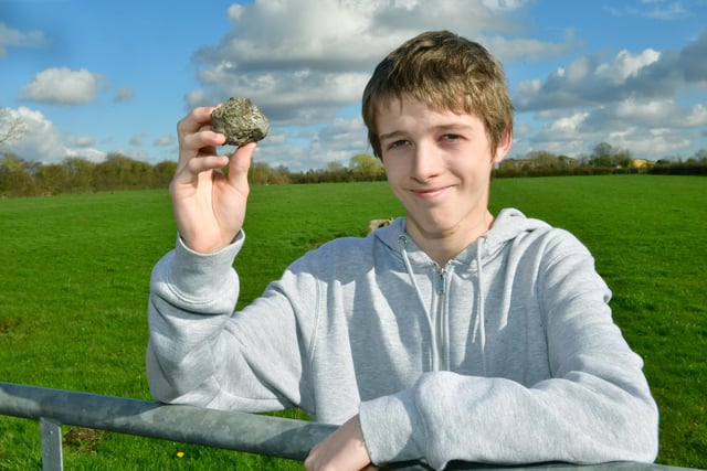 Christopher Patching, of Stickney, holding what he believes is a meteorite that he saw fall from the sky over Stickney.