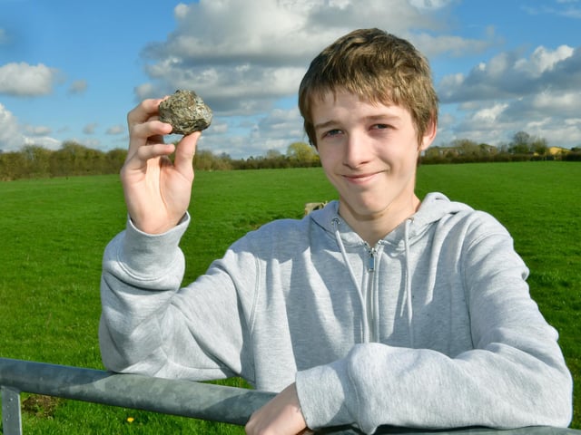 Christopher Patching, of Stickney, holding what he believes is a meteorite that he saw fall from the sky over Stickney.