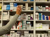 File photo dated 16/11/09 of a pharmacist stocking shelves at a chemist. Pharmacies could ease pressure on the NHS, according to an industry leader. As he prepared to enter into emergency talks with the Prime Minister on Saturday, executive director of Day Lewis pharmacy group Jay Patel said pharmacies could test and treat infections and play a more leading role in prescribing medications. Issue date: Saturday January 7, 2023.