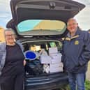 Rotarian Malcolm and daughter deliver goods for transport on to Ukraine