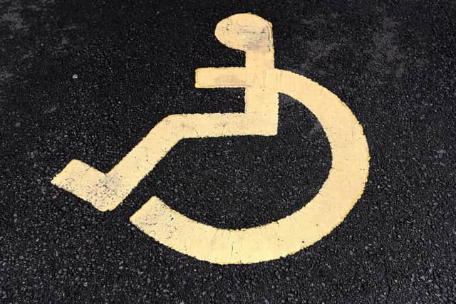 A sign for a disabled parking space