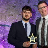 Ryan Crick collects his award from Tony Cockcroft