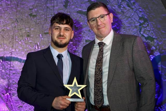 Ryan Crick collects his award from Tony Cockcroft