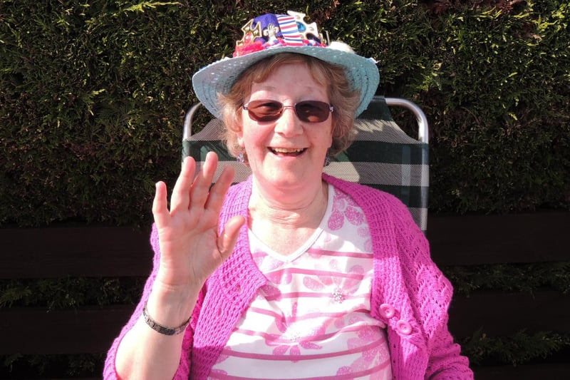 Giving a regal wave - Janet wood with her crown hat at Metheringham's coronation street party.