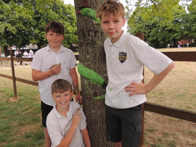 L-R - Year 6 pupils Ollie, William and Alex decorate their snake, moulded onto a tree during Cranwell School's outdoor learning week. Photo: AH