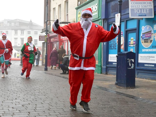 Action from this year's Boston Santa Run.