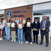 ​Mr Dickinson (right) and Mr Hermiston with successful GCSE students after receiving their results.