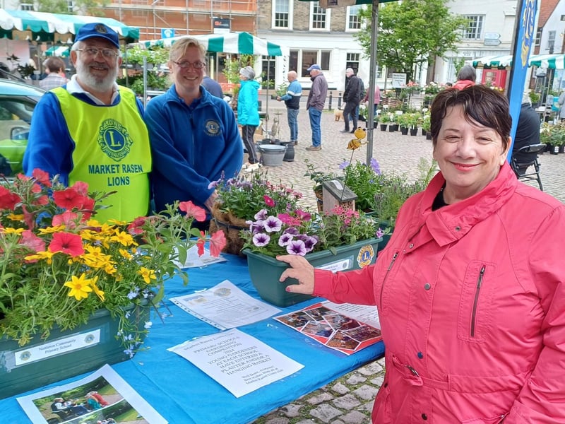 Children from local schools took part in the planter and basket competition. Rasen Mayor Jo Pilley is pictured with Lions John Fox and Jayne Hollingsworth at the schools' display stall