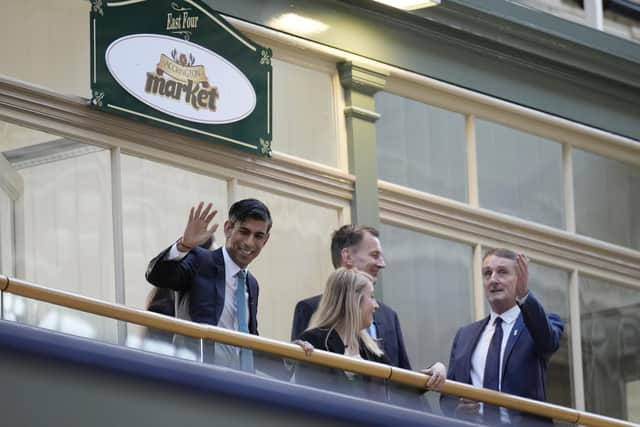 Prime Minister Rishi Sunak (left), Sara Britcliffe MP and Chancellor Jeremy Hunt (second right) during a community project visit to Accrington Market Hall in Lancashire, as a £2 billion investment in over 100 projects across the UK, through the levelling up fund has been announced. Picture date: Thursday January 19, 2023.