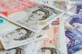 File photo of a pile of pound sterling notes