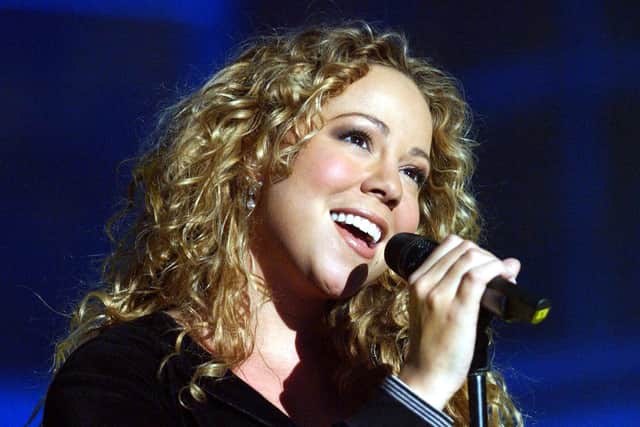 Guest star Mariah Carey performing during the fifth round of expulsions from BBC's Fame Academy at Shepperton Studios in west London. * 1/12/02: Pop diva Mariah Carey who has pledged in an interview with The Sunday Mirror Magazine, to "live life" and "enjoy" herself following a tough year in her professional and private life. The US star, who received a multi-million pay off from EMI, earlier this year after her album Glitter bombed, made the promise near the end of the year in which she was hosptalised for exhaustion and lost her father.