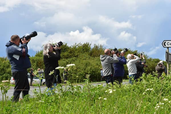 Lenses skyward. Aviation fans gathered near RAF Cranwell for the flyover rehearsal.