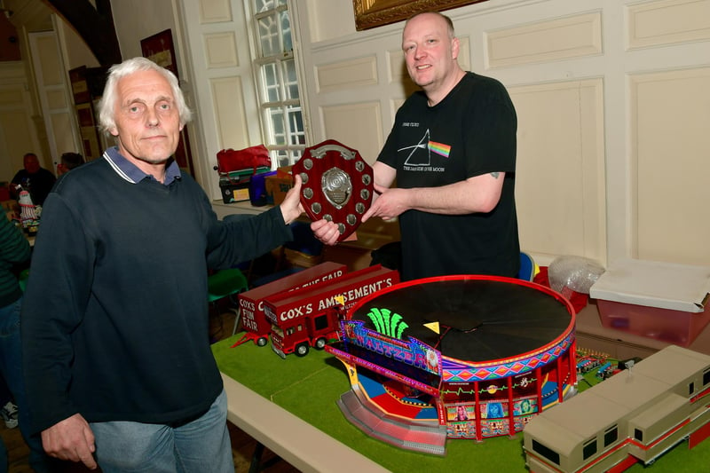 One of the organisers, Ian Thacker, presenting David Tomlinson with the Best on Show trophy at the model fairground exhibition at the Guildhall.