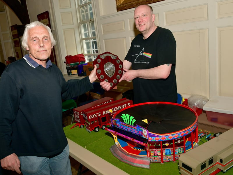 One of the organisers, Ian Thacker, presenting David Tomlinson with the Best on Show trophy at the model fairground exhibition at the Guildhall.