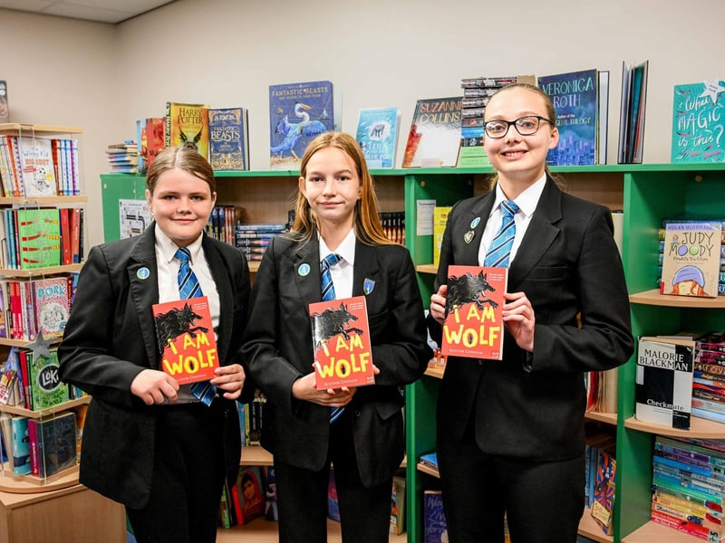Samantha Johnson, Trinity Barr and Madison Gough proud to show the library.