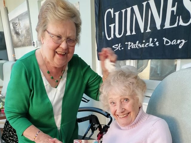 Jean Sweeney aka matron celebrating with resident Sheila Mann and handing our prizes.
