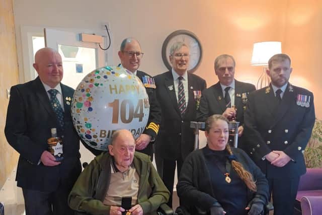 George with his Arctic Star Medal and members of the Royal Navy Association
