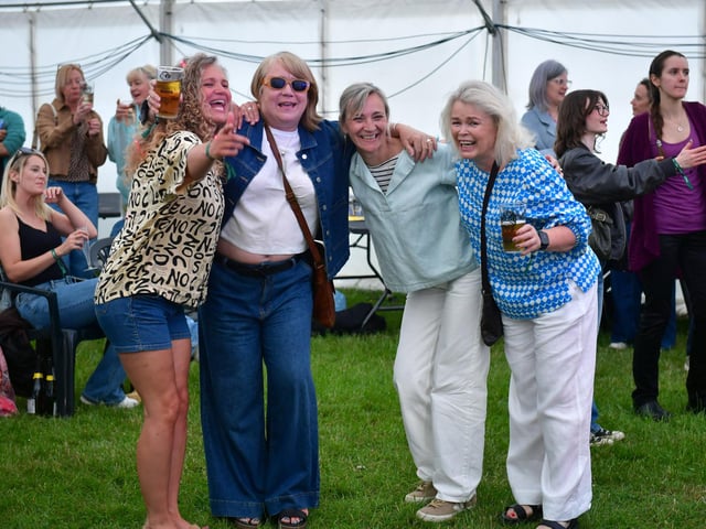 A group of friends enjoying the beer festival inside the marquee.