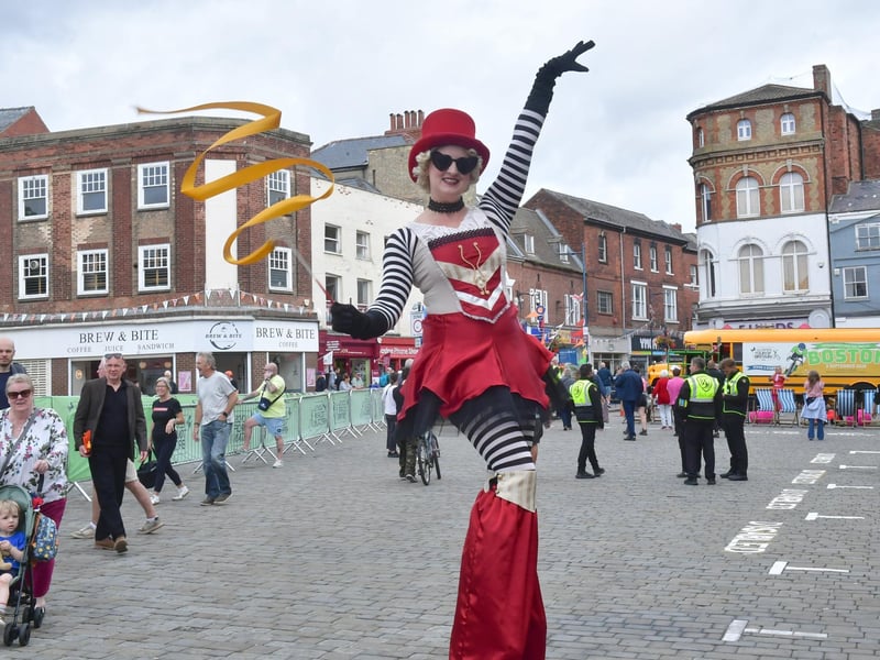 Stilt-walking was also part of the street entertainment.