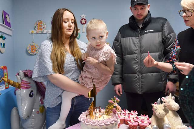 Lily with her family at her 4th birthday party.