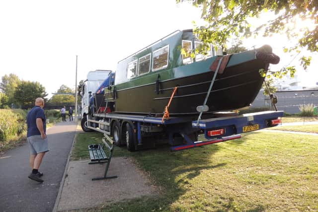 The new narrowboat arrives by truck at Eastgate Car Park.