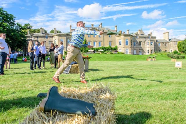 Welly wanging in full swing at the Lincolnshire Chamber of Commerce Summer Garden Party at Wellingore Hall, Wellingore. Photo:  Chris Vaughan Photography