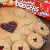 The giant Jammie Dodger - and how it sizes up to the shop-bought biscuit. Picture: B&M.