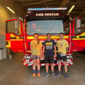 Lilli Atkins, Aaron McCarthy, and Nicky Hull back at Louth fire station on completing the 50 mile run.