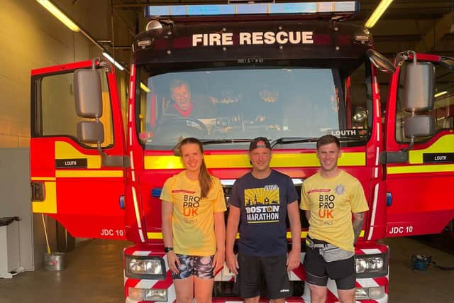 Lilli Atkins, Aaron McCarthy, and Nicky Hull back at Louth fire station on completing the 50 mile run.