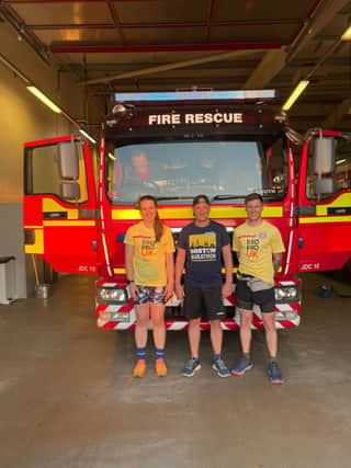 Lilli Atkins, Aaron McCarthy, and Nicky Hull back at Louth fire station on completing the 50 mile run.