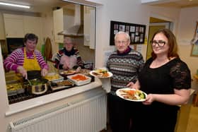 L-R Kath Martin, Judith Kirk, Rev Colin Martin and Oana Marian. serving up meals at Ruskington Methodist church's post-Christmas lunch. Photo: David Dawson