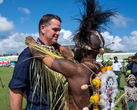 Capt. Joseph Dransfield receives a ceremonial Papua New Guinea necklace. (U.S. Navy photo by Ensign Madison Kwok)