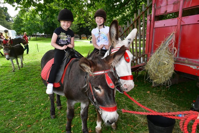Nikola Drapala, six, and Oliwia Drapala, nine, of Boston, enjoy a donkey ride at Central Park.
