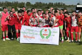 Skegness Town's players celebrate their cup win. Photo by David Johnson.