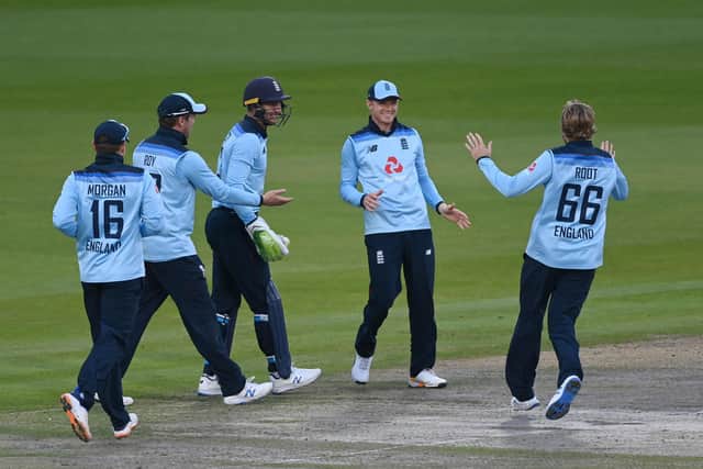 England's Sam Billings (2nd R) celebrates after running out Australia's Marnus Labuschagne at Old Trafford.  (